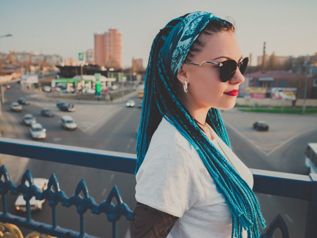 A modern woman with beautifully styled box braids.