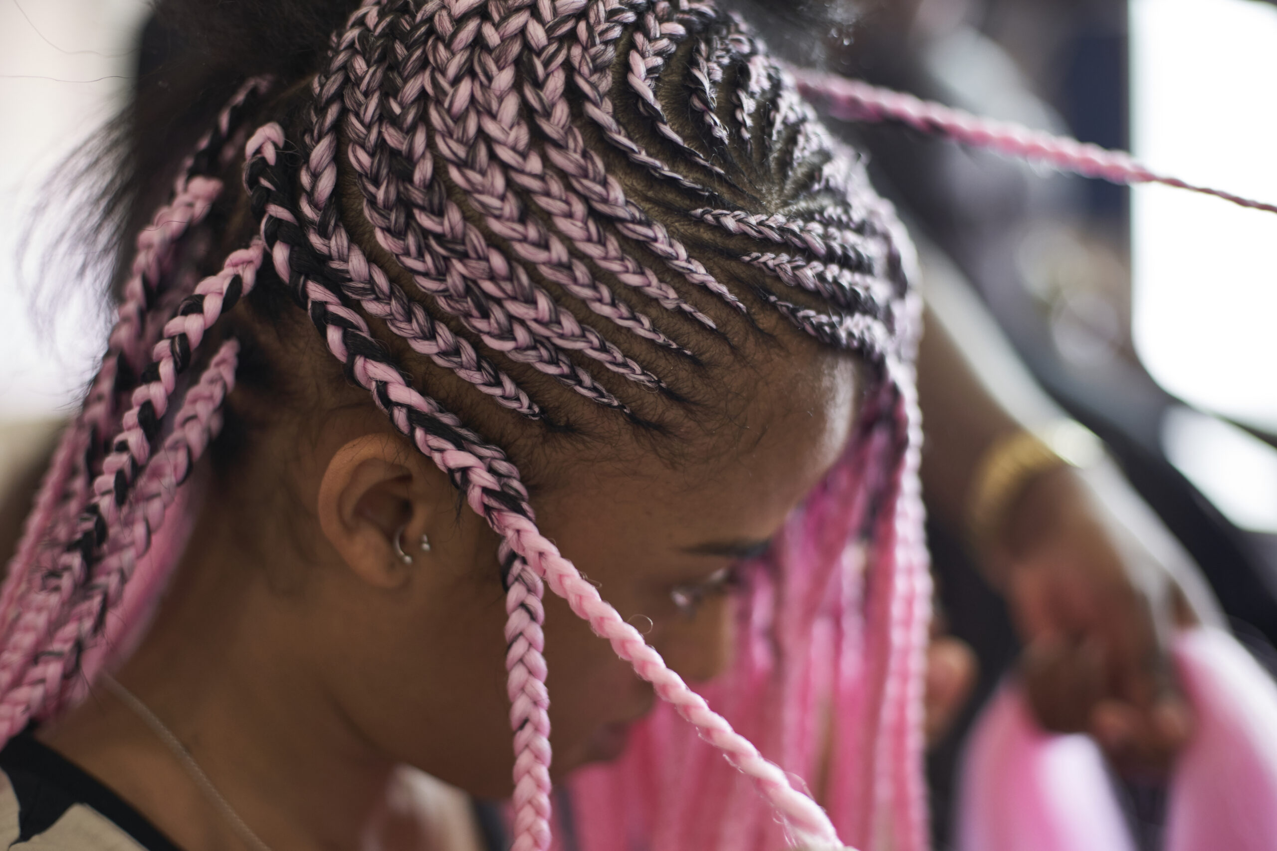 Young woman with pink braids, close-up